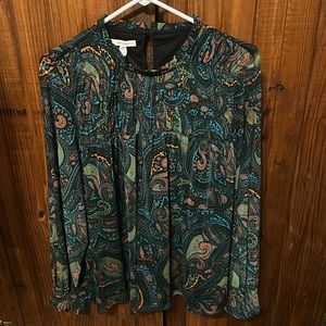 Women’s long sleeve top from Maurice’s. Never worn.